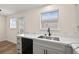 Modern kitchen with stainless steel appliances, gray cabinets and marble countertops at 7554 Violet Vista Ave # 201, Las Vegas, NV 89130
