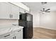 The kitchen features new countertops, cabinets, and black appliances, including a refrigerator at 7554 Violet Vista Ave # 201, Las Vegas, NV 89130