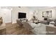 Bright living room with modern decor, featuring a comfortable sofa, chairs, and stylish coffee table on a textured rug at 7554 Violet Vista Ave # 201, Las Vegas, NV 89130