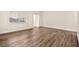 Spacious living room features lots of natural light, fresh paint, and lovely new flooring at 7554 Violet Vista Ave # 201, Las Vegas, NV 89130