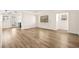 This spacious living room is filled with natural light and features beautiful new flooring at 7554 Violet Vista Ave # 201, Las Vegas, NV 89130