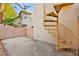 Private patio with a unique spiral staircase for access to upper level at 7554 Violet Vista Ave # 201, Las Vegas, NV 89130