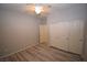 Bedroom with hardwood floors, closet with folding doors, and neutral gray walls at 8084 Bosco Bay Ave, Las Vegas, NV 89113