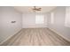 Bright, spacious bedroom with hardwood floors, and three windows with white shutters at 8084 Bosco Bay Ave, Las Vegas, NV 89113