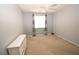Bedroom with carpet, neutral walls, and a ceiling fan at 8084 Bosco Bay Ave, Las Vegas, NV 89113