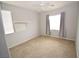 Bedroom featuring carpet, a window, and light gray walls at 8084 Bosco Bay Ave, Las Vegas, NV 89113