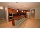 Spacious kitchen with stainless steel appliances, dark granite counters, and center island at 8084 Bosco Bay Ave, Las Vegas, NV 89113