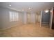 Spacious living room with neutral walls, tiled floors, shuttered windows and plenty of natural light at 8084 Bosco Bay Ave, Las Vegas, NV 89113