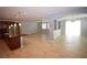 Open concept living room and kitchen featuring tile floors and stainless steel appliances at 8084 Bosco Bay Ave, Las Vegas, NV 89113