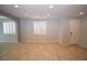 Spacious living room with neutral walls, tiled floors, shuttered windows and plenty of natural light at 8084 Bosco Bay Ave, Las Vegas, NV 89113