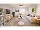 Living room with comfortable seating, bright natural light, and modern decor at 8084 Bosco Bay Ave, Las Vegas, NV 89113