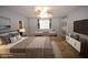 Staged bedroom features carpet, ceiling fan and decor at 8084 Bosco Bay Ave, Las Vegas, NV 89113