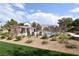 Community pool area featuring lounge chairs, landscaping and an attractive fence at 8084 Bosco Bay Ave, Las Vegas, NV 89113