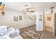 Spacious bedroom featuring ample closet space, a ceiling fan, and desk area near the window at 8552 Desert Holly Dr, Las Vegas, NV 89134