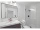 Modern bathroom featuring a sleek vanity with a minimalist mirror and a glass-enclosed shower with stylish tile work at 8600 W Charleston Blvd # 2098, Las Vegas, NV 89117