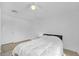 Clean bedroom with a ceiling fan, wood-look floors and a large window offering natural light at 8600 W Charleston Blvd # 2098, Las Vegas, NV 89117