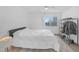 Bright bedroom with a large window, light colored carpet and a ceiling fan for comfort and natural light at 8600 W Charleston Blvd # 2098, Las Vegas, NV 89117