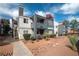 Attractive multi-story building with well-maintained landscaping, offering a glimpse of the property's exterior at 8600 W Charleston Blvd # 2098, Las Vegas, NV 89117