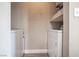 Efficient laundry room with a modern washer and dryer set and convenient shelving for storage at 8600 W Charleston Blvd # 2098, Las Vegas, NV 89117