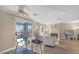 Sun-filled living room with modern decor, wood floors, and glass top desk, with a cozy fireplace at 8600 W Charleston Blvd # 2098, Las Vegas, NV 89117