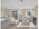 Bright living room features modern furniture, wood floors, fireplace, and sliding glass doors to outdoor space at 8600 W Charleston Blvd # 2098, Las Vegas, NV 89117