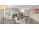 Open-concept living area with fireplace, wood floors, lots of natural light, and flows into dining or kitchen area at 8600 W Charleston Blvd # 2098, Las Vegas, NV 89117