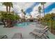 Inviting community pool area with palm trees, comfortable lounge chairs, and a relaxing spa at 8600 W Charleston Blvd # 2098, Las Vegas, NV 89117