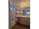 Bathroom featuring a shower-tub combo and double sink vanity at 8993 Secret Valley St, Las Vegas, NV 89139
