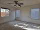 Bedroom with ceiling fan and two windows at 8993 Secret Valley St, Las Vegas, NV 89139