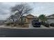 Inviting single-story home with desert landscaping, a two car garage, and a well-maintained lawn at 8993 Secret Valley St, Las Vegas, NV 89139