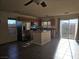 Bright kitchen with stainless steel refrigerator, granite countertops and tile flooring at 8993 Secret Valley St, Las Vegas, NV 89139