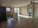 Open floor plan with stainless steel refrigerator, island, and tile floors at 8993 Secret Valley St, Las Vegas, NV 89139