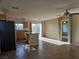 Open kitchen layout with island, stainless steel appliances, and tile flooring at 8993 Secret Valley St, Las Vegas, NV 89139