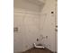 Laundry room with overhead shelving and connections for a washer and dryer at 8993 Secret Valley St, Las Vegas, NV 89139