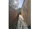 Side yard of home with concrete walkway at 8993 Secret Valley St, Las Vegas, NV 89139
