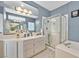 Bright bathroom with double sinks, shower, soaking tub and natural light at 9225 Evergreen Canyon Dr, Las Vegas, NV 89134