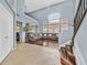 Spacious living room with tall ceilings, hardwood floors, and staircase with natural light at 9225 Evergreen Canyon Dr, Las Vegas, NV 89134