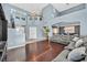 Expansive living room with hardwood floors, soaring ceilings, and a comfortable sectional sofa at 9225 Evergreen Canyon Dr, Las Vegas, NV 89134