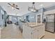 Open-concept kitchen/living area featuring island seating, stainless appliances, and outside access at 9225 Evergreen Canyon Dr, Las Vegas, NV 89134