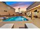 Backyard pool and spa with lounge chairs for sunny relaxation at 9225 Evergreen Canyon Dr, Las Vegas, NV 89134