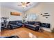 Living room with high ceilings, ceiling fan, and hardwood floor at 9356 Column Cactus St, Las Vegas, NV 89139