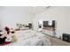 Bright bedroom with white walls, neutral carpet, ceiling fan and a view into another room at 984 Brilliant Meadow Ave, North Las Vegas, NV 89086