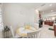 Cozy dining area features a round table with white chairs, and easy access to the kitchen at 984 Brilliant Meadow Ave, North Las Vegas, NV 89086