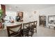 Kitchen island with granite countertops and barstools offers ample seating at 984 Brilliant Meadow Ave, North Las Vegas, NV 89086