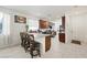 Bright kitchen boasts granite counters, dark cabinetry, and bar seating at 984 Brilliant Meadow Ave, North Las Vegas, NV 89086