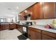 The kitchen showcases dark wood cabinetry, granite countertops, and modern appliances at 984 Brilliant Meadow Ave, North Las Vegas, NV 89086