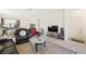 Cozy living area with a modern TV and an entryway at 984 Brilliant Meadow Ave, North Las Vegas, NV 89086