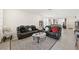 Comfortable living room with leather sofas and patterned rug at 984 Brilliant Meadow Ave, North Las Vegas, NV 89086