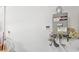 Efficient tankless water heater system mounted on a white wall with visible plumbing and controls at 984 Brilliant Meadow Ave, North Las Vegas, NV 89086