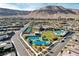 Community aerial view featuring a large pool, tennis courts, community center and numerous single-Gathering homes at 10001 Regency Square Ave, Las Vegas, NV 89148